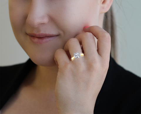 Gold solitaire round engagement ring deals